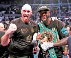  ??  ?? Deontay Wilder (right) and Tyson Fury after the fight at Staples Centre in Los Angeles, United States. — Reuters photo