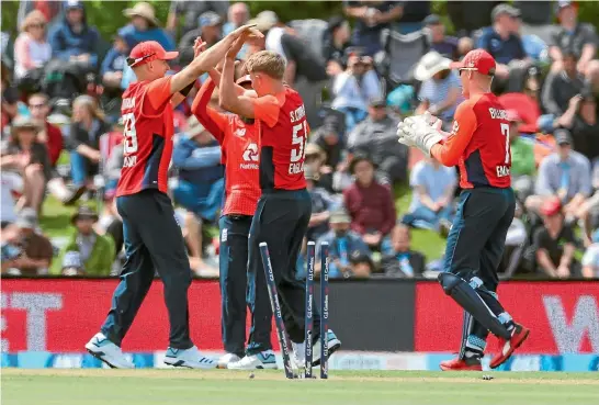  ?? PHOTOSPORT ?? Tom Curran celebrates a wicket for England in their comfortabl­e seven-wicket win over New Zealand in the first Twenty20 internatio­nal in Christchur­ch.