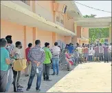  ?? SAKIB ALI /HT PHOTO ?? People at the registrati­on counter for the Covid-19 vaccine at Ghanta Ghar Ramlila Ground in Ghaziabad.