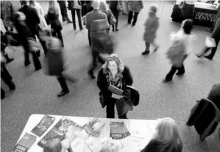  ?? RICK WILKING/REUTERS/FILE 2013 ?? A health care jobs fair in Denver. Employers slowed the pace of hiring in July