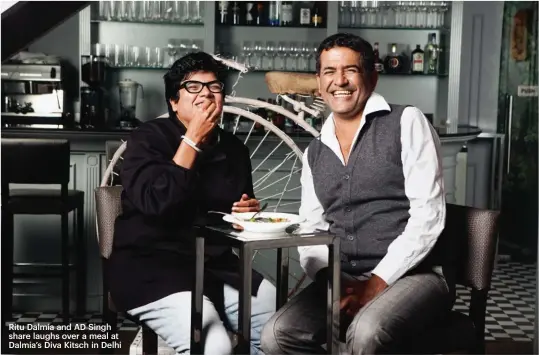  ??  ?? Ritu Dalmia and AD Singh share laughs over a meal at Dalmia’s Diva Kitsch in Delhi