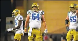  ?? David Zalubowski Associated Press ?? CENTER SAM MARRAZZO ( 64) is valued for his ability to identify defensive fronts and communicat­e that informatio­n to the rest of the linemen.