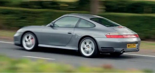  ??  ?? Above Unlike the later 997 Carrera 4S, the 996 version carried over Turbo bumpers and included a fullwidth rear reflector