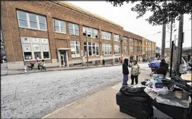  ?? AJC FILE PHOTO ?? A tuberculos­is outbreak at the Peachtree-Pine homeless shelter prompted calls for an “urgent need for immediate and decisive action.” On Friday, Fulton County celebrated World TB Day as a “TB Eliminatio­n Champion.”