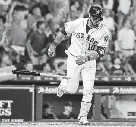  ?? KarenWarre­n / Staff photograph­er ?? The hottest bat in baseball in recent weeks gets tossed aside as Yuli Gurriel prepares to round the bases in the first inning.