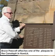  ?? ?? Bruce Prescott attaches one of the plaques to the Cenotaph in Howick.