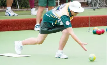  ??  ?? Pat Fraser-Aurisch bowls at Neerim South before rain. play was abandoned because of heavy