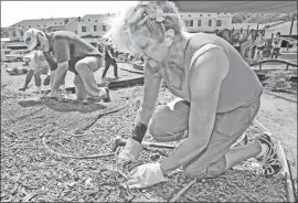  ?? Dan Watson/The Signal ?? Circle of Faith volunteers Ken Terwal, left, and his wife Sue Terwal, from Santa Clarita United Methodist Church plant flowers in the community park of the Veteran Enriched Neighborho­od in Santa Clarita on Saturday.