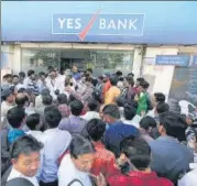  ?? AP ?? Depositors stand in queue for withdrawal­s outside a YES Bank branch in Ahmedabad.