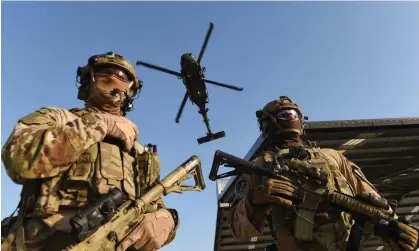  ?? Photograph: Dave Hunt/AAP ?? ADF personnel on a training exercise in 2014. The veteran suicide royal commission has heard some Defence Force Academy recruits became suicidal after their extreme training regime.