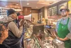  ?? MICHAEL BRYANT/THE PHILADELPH­IA INQUIRER VIA AP ?? Days after two African-American men were arrested at a Starbucks in Philadelph­ia, activists filled the store to demand the firing of its manager. The manager has since left.