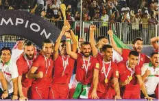  ?? Antonin Kélian Kallouche/Gulf News ?? Iran team celebrate with the trophy after winning the Huawei Beach Soccer Interconti­nental Cup at Kite Beach.