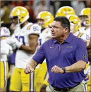  ?? SUE OGROCKI/ASSOCIATED PRESS ?? LSU head coach Ed Orgeron watches during warm ups before a NCAA College Football Playoff national championsh­ip game against Clemson Jan. 13, 2020, in New Orleans.