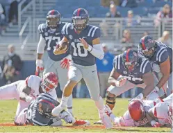  ?? THOMAS GRANING/ASSOCIATED PRESS FILE PHOTO ?? Mississipp­i quarterbac­k Jordan Ta’amu is one of several Hawaiian players making an impact on their teams.