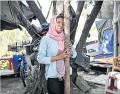  ?? AFP ?? A female refugee at the Samos camp in the town of Vathy on Sept 19.