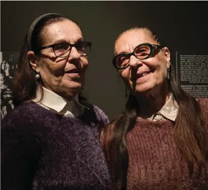  ??  ?? Holocaust survivors from Auschwitz concentrat­ion camp, twins sisters Lia Huber, left, and Judith Barnea attend the opening of "Flashes of Memory" exhibition of the photos and videos from the Holocaust at the Yad Vashem Holocaust memorial in Jerusalem.