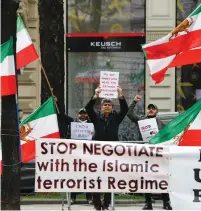  ?? (Leonhard Foeger/Reuters) ?? IRANIAN ACTIVISTS protest outside a meeting of the JCPOA’s Joint Commission in Vienna this week.