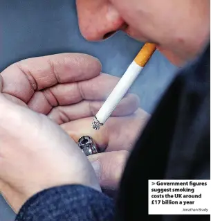  ?? Jonathan Brady ?? > Government figures suggest smoking costs the UK around £17 billion a year