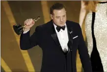  ?? AP photo ?? Brendan Fraser accepts the award for best performanc­e by an actor in a leading role for “The Whale” at the Oscars on Sunday at the Dolby Theatre in Los Angeles.