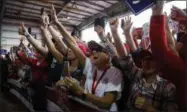  ?? EVAN VUCCI — THE ASSOCIATED PRESS ?? Supporters of President Donald Trump cheer as he arrives to speak at a campaign rally Sunday in Macon, Ga.