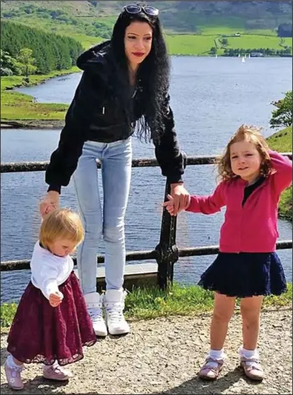  ??  ?? Sunshine stroll: Samira Lupidi poses with daughters Jasmine, left, and Evelyn on a trip to a lake