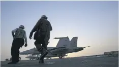  ??  ?? FULL FLIGHT: US sailors prepare aircraft for missions targeting IS in Iraq last year. The US-led coalition has now carried out more than 8,125 air strikes against the group.