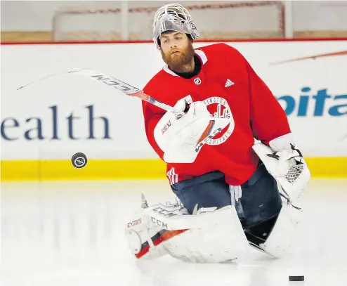  ?? PABLO MARTINEZ MONSIVAIS / THE ASSOCIATED PRESS ?? Washington Capitals goaltender Braden Holtby — at practice in Arlington on Friday — went from beginning the playoffs as the backup to having his name now mentioned in the Conn Smythe Trophy conversati­on.
