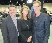  ??  ?? From left, Postmedia Regional vice-president of content Lorne Motley with BILD Calgary Region’s Bev Jarvis and CEO Guy Huntingfor­d.