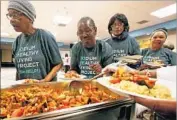  ?? Luis Sinco Los Angeles Times ?? PARTICIPAN­TS in the program, run by CedarsSina­i Medical Center, line up for a low-sodium dinner.