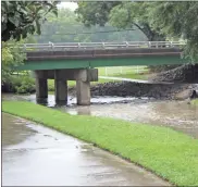  ?? Kevin Myrick / ?? Rainfall hit Rockmart too, but not as heavy in the downtown area as it did in Cedartown on Tuesday, July 31. Euharlee Creek was running faster and on the rise from the increase of water overall in the county during usually dry times.