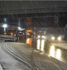  ??  ?? READY FOR THE WORST: Snow removal equipment stage under the Interstate 93 overpass at Union Street in Braintree on Sunday night.