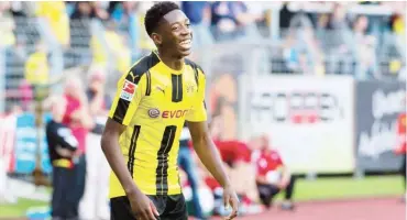  ??  ?? Borussia Dortmund youngster, Ousmane Dembele celebrates after scoring a goal in the Bundesliga. Dortmund are demanding for £135m from Barcelona for the striker