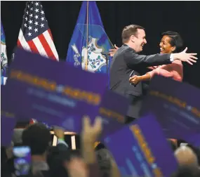  ?? Jessica Hill / Associated Press ?? U.S. Sen. Chris Murphy embraces candidate for congress Jahana Hayes at a rally in Hartford on Friday.