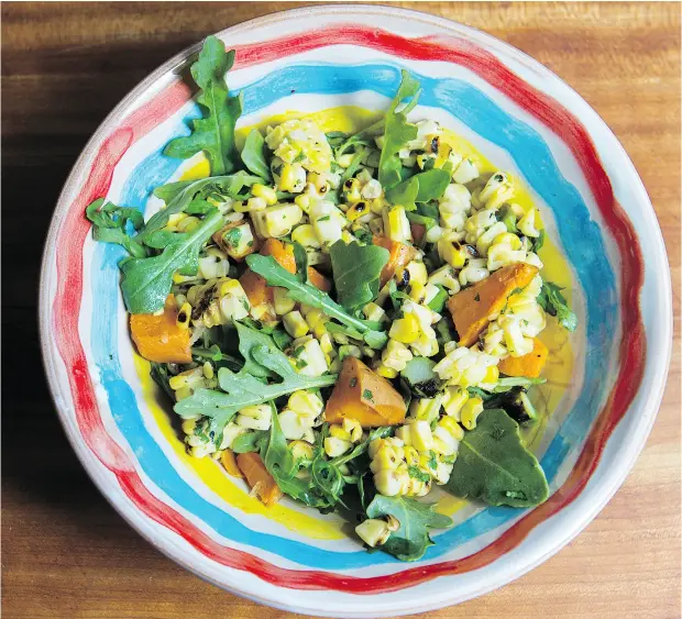  ?? LAURA PEDERSEN / NATIONAL POST ?? Bonnie Stern’s grilled corn and sweet potato salad with arugula. For summer salads, you can change ingredient­s to make your salad an appetizer, side dish or main course, depending on what’s in season or in your fridge.