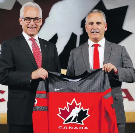  ?? AL CHAREST ?? Hockey Canada CEO Tom Renney, left, introduces former Vancouver Canucks head coach Willie Desjardins as the man who will be behind the bench for Team Canada at the 2018 Olympics. Desjardins said fans will enjoy seeing lesser-known Canadian players rise...