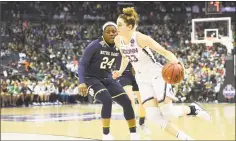  ?? Justin Tafoya / NCAA Photos via Getty Images ?? UConn’s Katie Lou Samuelson drives to the basket against Notre Dame’s Arike Ogunbowale during the semifinal game of the 2018 NCAA Division I Women's Basketball Final Four on March 30 at Nationwide Arena in Columbus, Ohio. Notre Dame defeated UConn 91-89 to advance to the national championsh­ip.