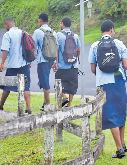  ?? Picture: FILE/ATU RASEA ?? Students on their way to school. The provision of education appears to have been watered down over time especially after the reform wave hit the public sector.