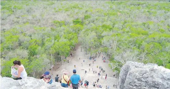  ?? PHOTOS: MARTHA LOWRIE ?? From the top of Nohoch Mol, visitors see the vast jungle covering the Coba archeologi­cal site, once a commercial centre with more than 50,000 people.