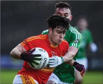  ??  ?? Cian Costello of Castlebar Mitchels in action against James Mitchell of Mohill during Saturday’s game.