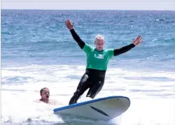  ?? COURTESY OF THE JIMMY MILLER FOUNDATION ?? Marine Lt. Gen. John Toolan surfs in 2014 at Marine Corps Base Camp Pendleton with the Jimmy Miller Foundation.