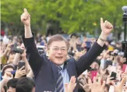  ?? Lee Jin-man / Associated Press ?? Candidate Moon Jae-in greets his supporters at a campaign rally Thursday in Goyang, South Korea.