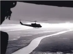  ??  ?? South Vietnamese troops fly over the Mekong Delta in 1963.