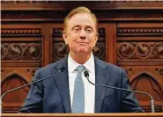  ?? Jessica Hill / Associated Press ?? Under a proposal from Gov. Ned Lamont, Connecticu­t would be the first state to systematic­ally cancel medical debt for residents.