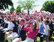  ?? DARRYL DYCK/THE CANADIAN PRESS FILE PHOTO ?? New Canadians celebrate after taking the oath of citizenshi­p during a special July 1 ceremony in West Vancouver.