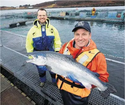  ??  ?? GOOD CATCH: Barrie Aird, left, of the Bank of Scotland with Gilpin Bradley MD of Wester Ross Fisheries