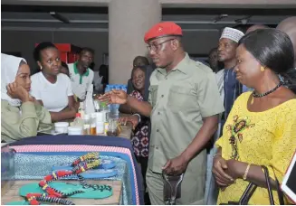  ??  ?? Minister of Youth and Sports Developmen­t, Solomon Dalung (2nd right); inspects products made by a corps member during the World Youth Skill Acquisitio­n Day celebratio­n in Abuja yesterday. With him are the NYSC Director-General’s representa­tive, Mrs Kwajafa Hauwa (right) and other stakeholde­rs.