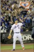  ?? BILL KOSTROUN — THE ASSOCIATED PRESS ?? Mets third baseman David Wright acknowledg­es the fans as he gets a standing ovation beforeSatu­rday’s gane in New York.