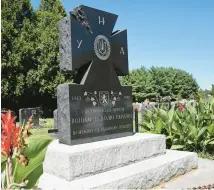  ?? YONG KIM/PHILADELPH­IA INQUIRER ?? The monument at St. Mary’s Ukrainian Catholic Cemetery in Elkins Park honors the 14th Waffen Grenadier Division of the SS. The church decided this week to cover it amid new attention to its presence outside Philadelph­ia.