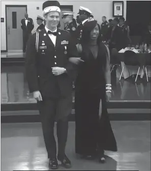  ??  ?? Thomas Stone High School senior Douglas Goodell, left, was crowned as king at the 10th annual Col. Donald M. Wade Joint Services Military Ball held Friday, Dec. 9. The event honors senior cadets enrolled in Charles County Public Schools JROTC programs....