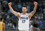  ?? DAVID ZALUBOWSKI — THE ASSOCIATED PRESS ?? Philadelph­ia 76ers guard JJ Redick celebrates in the final moments of a 107-102 win against the Denver Nuggets.